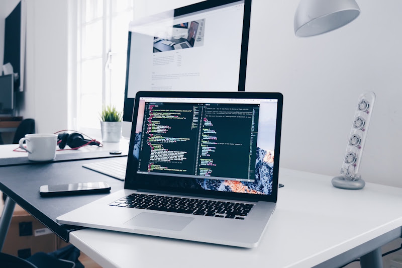 Choosing the Best Faxing Software: Key Features To Look For A laptop on a desk with software running in the background.
